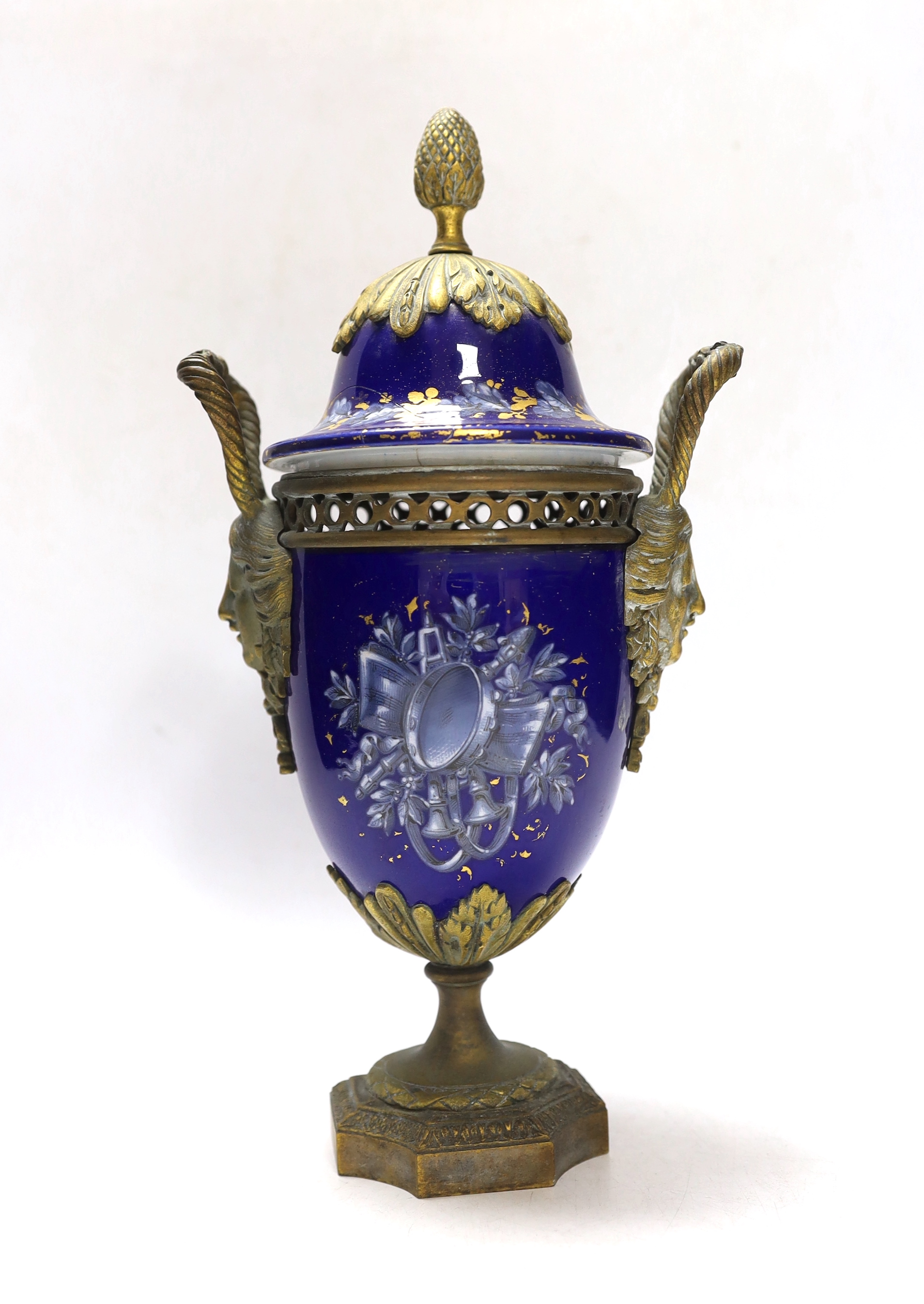 A Limoges style porcelain ormolu mounted urn and cover, 29cm high